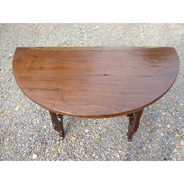 Spanish / Goya era styled console in rich European walnut. A demilune shape that fits numerous settings. Golden amber...