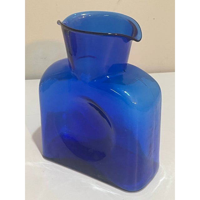 A beautiful MCM cobalt blue glass vase, double spout pitcher. The classic handblown glass 384 made by Blenko Glass, West...