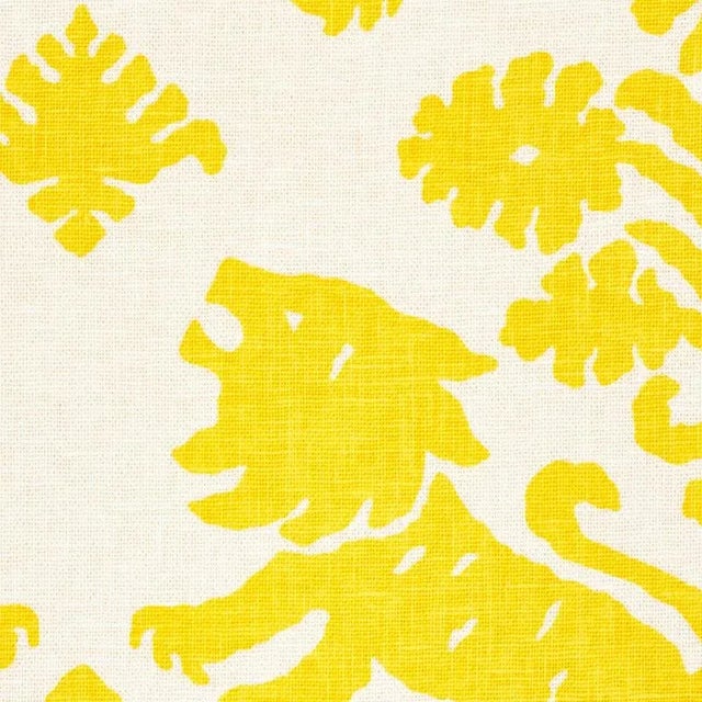 This artisanal print features mirrored silhouettes of rampant lions and stylized flowers on a textural union cloth ground....