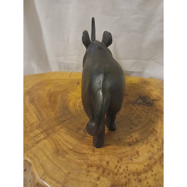 This is a vintage hand carved ebony wood rinoceros. The wood is almost very dark almost black in color. These sculptures...