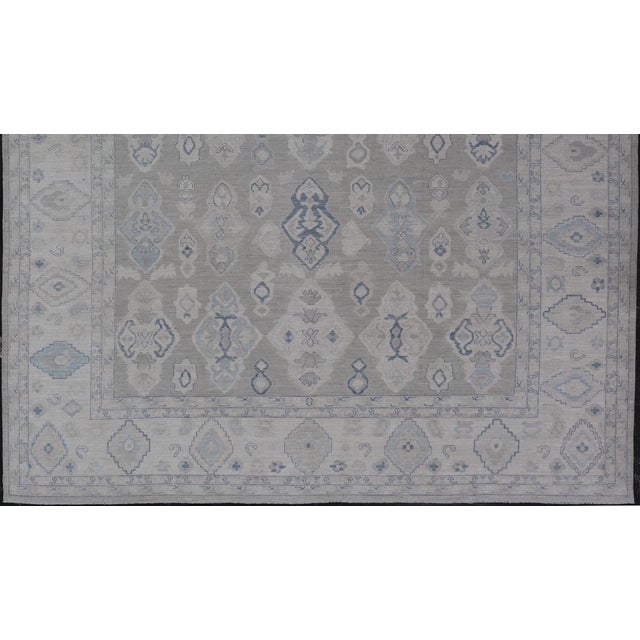 Tribal Turkish Oushak Rug With Soft Gray Field and Pale Blue Geometric Motifs For Sale - Image 3 of 16