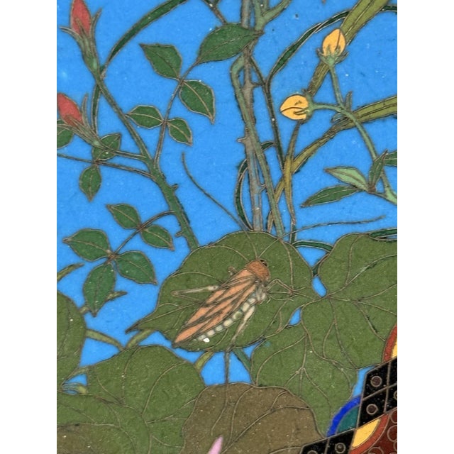 This finely executed Japanese cloisonne enamel dish, measuring approximately 12 inches in diameter, dates to the Meiji...