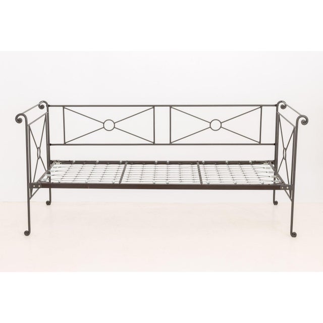 Vintage Wrought Iron Daybed Frame, with scroll work motif, atop casters. 36.75" H x 84" W x 35" D. Provenance: From a...
