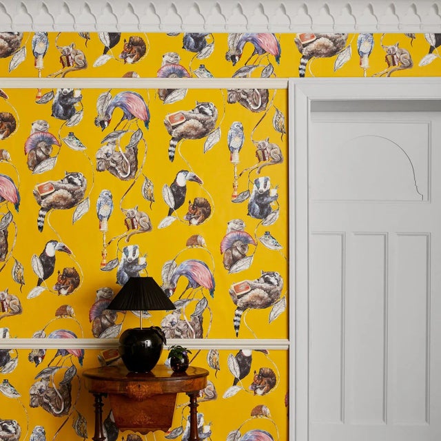 A rich ochre-yellow provides the backdrop to an assembly of curious critters in 'HACKNEY EMPIRE'. This enchanting print...