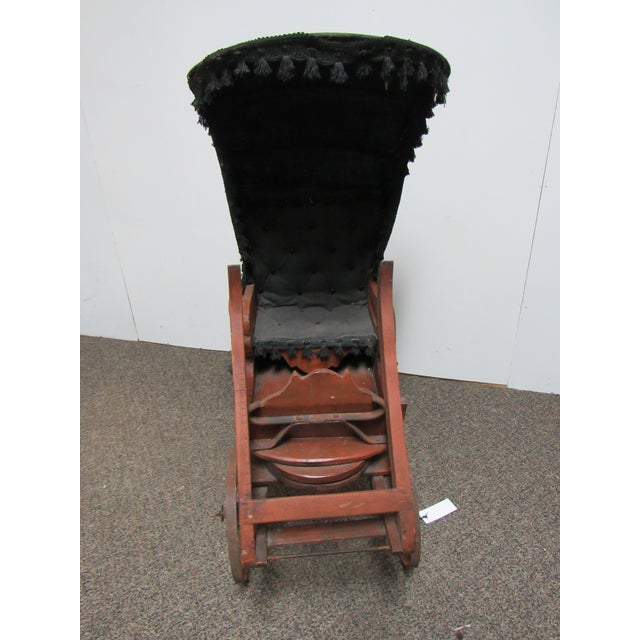 Beautiful antique English goat cart featuring a handcrafted wooden body, metal spoked wheels, and dramatic black canopy...