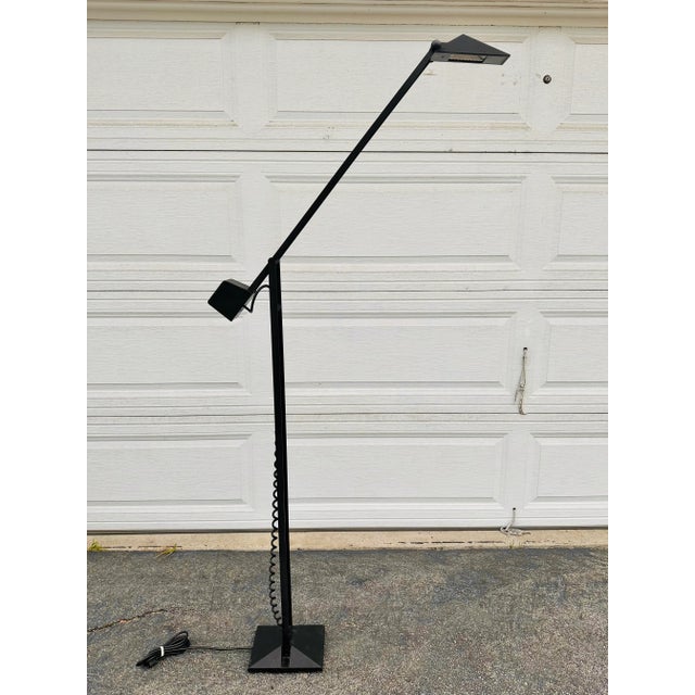 Vintage Post modern Floor lamp. Halogen bulb and cast-iron frame balance floor lamp. Adjustable angles by counterweight...