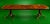 This Baker Furniture Georgian Banded Mahogany Double Pedestal Extension Dining Table is a gorgeous, substantial and...
