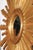 A large vintage French sunburst mirror from the mid-20th century, with convex mirror and radiating rays. This captivating...
