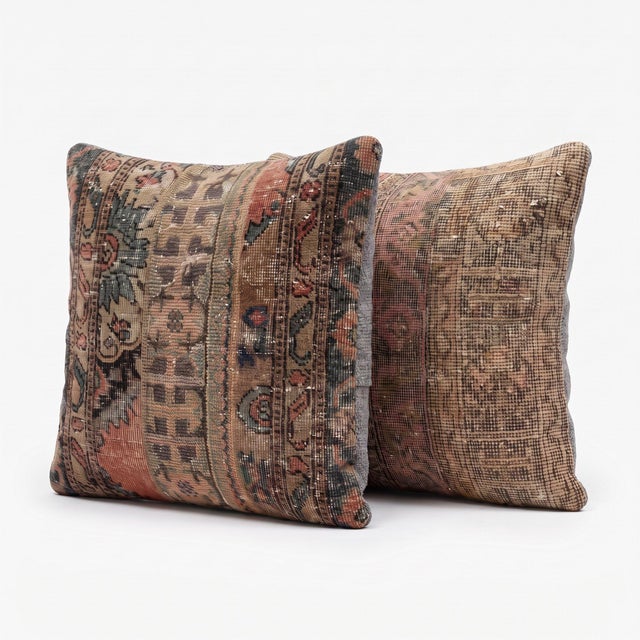 This 24'' x 24'' pillow cover set was made from authentic Turkish rug pieces — muted floral borders in camel, rust and...