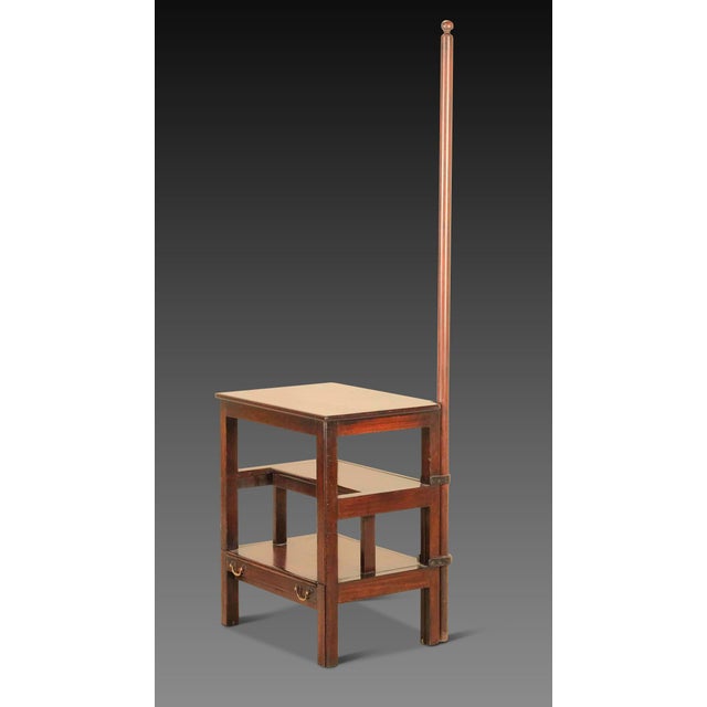An unusual flight of substantial late 18th Century Mahogany library steps, with a tall handrail, above a set of pullout...