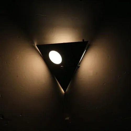 Black metal ‘Night Owl’ wall lamp for Raak, the Netherlands in the 1960s. A unique and beautiful lamp by Raak. This lamp...