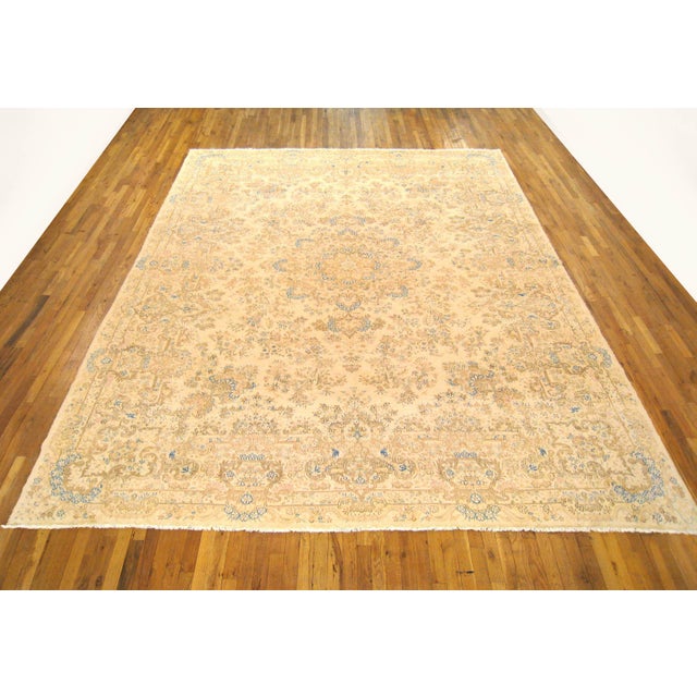 Antique Persian Kerman oriental carpet, size 13'8" H x 9'9" W, circa 1920. This antique hand-knotted Persian rug features...