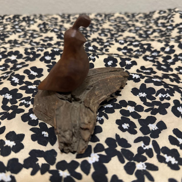 The hand-carved sculpture in your image appears to be a Woodcraft Quail Figure or a similar mid-century modern folk art...