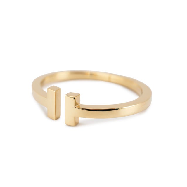 Brand: Tiffany & Co. Gender: Ladies Metal Type: 18K Yellow Gold Length: 6.75 inches Width: 15.00 mm tapering to 5.00 mm...