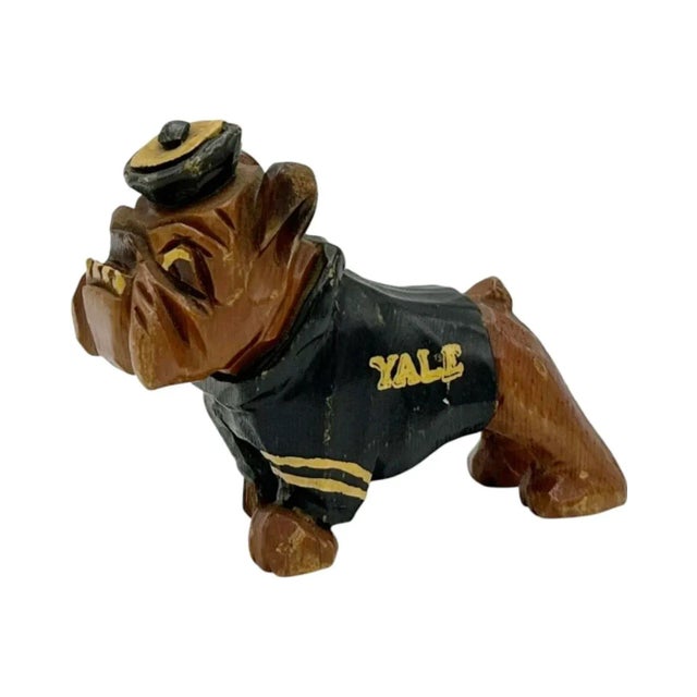 Details: -Vintage Yale University wooden bulldog mascot by Carter Hoffman -Charming wooden bulldog wearing hat and sweater...