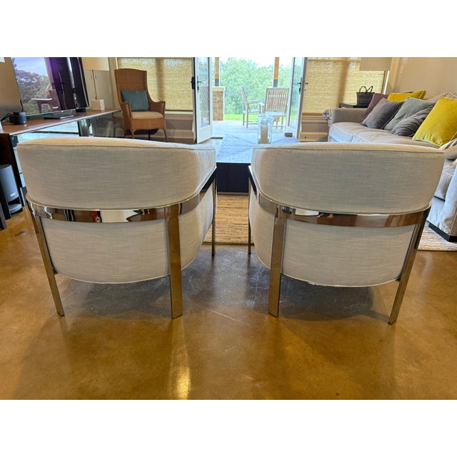 A 1970s-inspired silhouette distinguishes our tailored club chair. Supported by a sleek, flat-metal bar frame, the slope-...