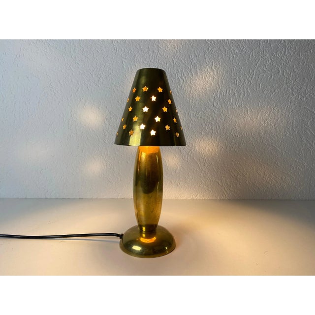 A table lamp made in the 1980s by studio lambert. Made by solid brass. The light requires one e14 light bulb. Works with...