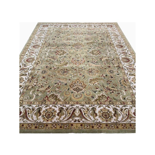 Enhance your home with the captivating beauty of this 10x14 Indian Agra Area Rug. Handwoven in the Agra region of India,...