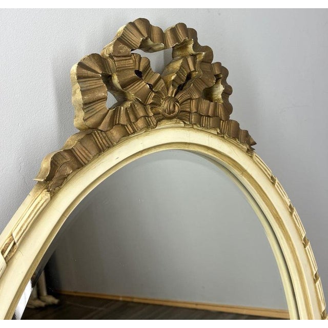 This charming Vintage Shabby Chic mirror features an elegant oval frame topped with a beautifully detailed bow motif,...