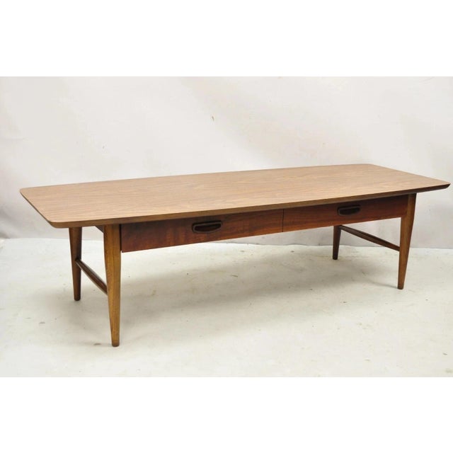 Vintage Lane Mid Century Modern 56" Long Surfboard Laminate Top Coffee Table with Drawer. Circa Mid 20th Century....