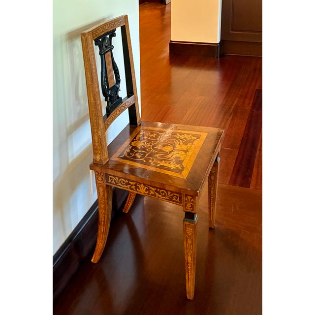 Refined circa 1900 marquetry side chair featuring exceptional inlaid decoration and a sculptural lyre-form back. The chair...