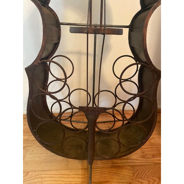 Vintage Art Deco Metal Cello Wine Rack Bar measures about 54” tall x 17” wide Holds 10 bottles and has glass holders too...