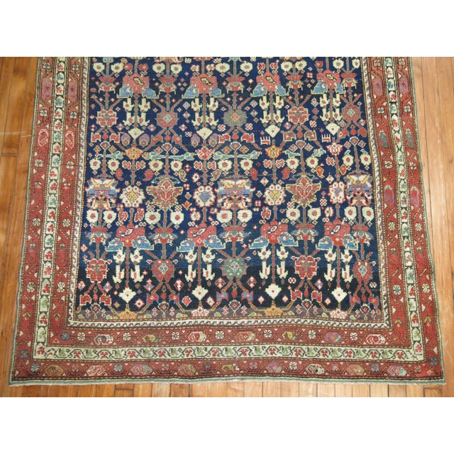 Intermediate size Persian Malayer rug with an all-over repetitive motif on a navy blue field. Primitive, masculine for the...