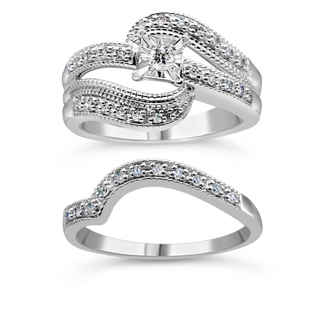 Surprise your beautiful bride with stunning natural diamonds! This 1/3 cttw round diamond engagement ring is an elegant...