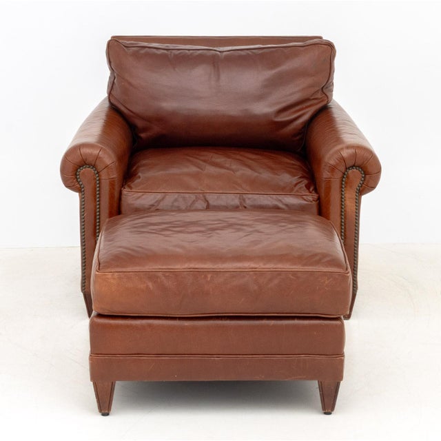 Ralph Lauren Leather Club Arm Chair and Ottoman, label to underside. Armchair: 33" H x 40" W x 42" D; seat 18" H; Ottoman:...