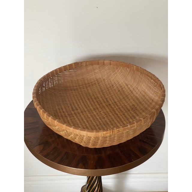 Vintage pair of handwoven Reed wicker baskets.