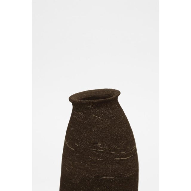 Stomata 7 vase by Anna Karountzou Dimensions: D 9 x H 31 cm Materials: mixed black and white stoneware clay, clear glaze...