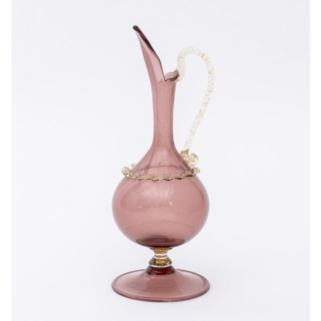 Two Murano Gold-Flecked Glass Vessels, mid-20th century, one green glass vase with applied handles and one amethyst glass...