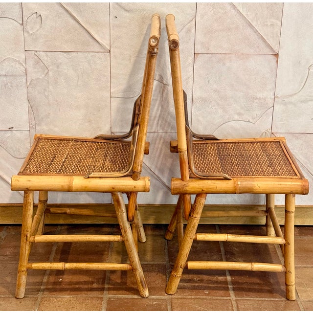 A Rare Pair of Vintage 1970’s Chinoiserie Bamboo Ladder Back Accent Chair With Woven Rattan Seat. In the iconic Paul...