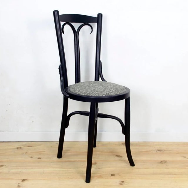 Chair made from the beginning of the twentieth century. Restored, painted matte black and upholstered with fabric gray.