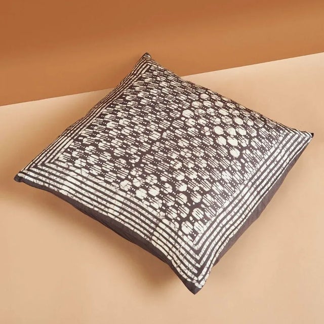 Oasis Charcoal Silk Pillow is luxurious and exquisite with its unique wax block print, which is handcrafted carefully to...