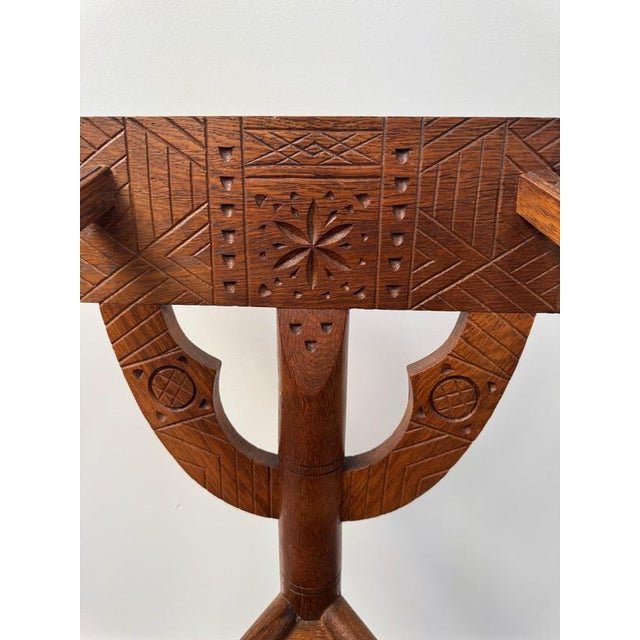Swedish oak "Monk chair" with ethnic styling and intricate carving Designed C1930 by Bernhardt Hoettger
