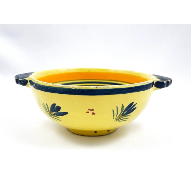 Vintage Henriot Quimper handled bowl in classic Soleil Yellow pattern with Breton Man & floral motif. Signed on reverse:...