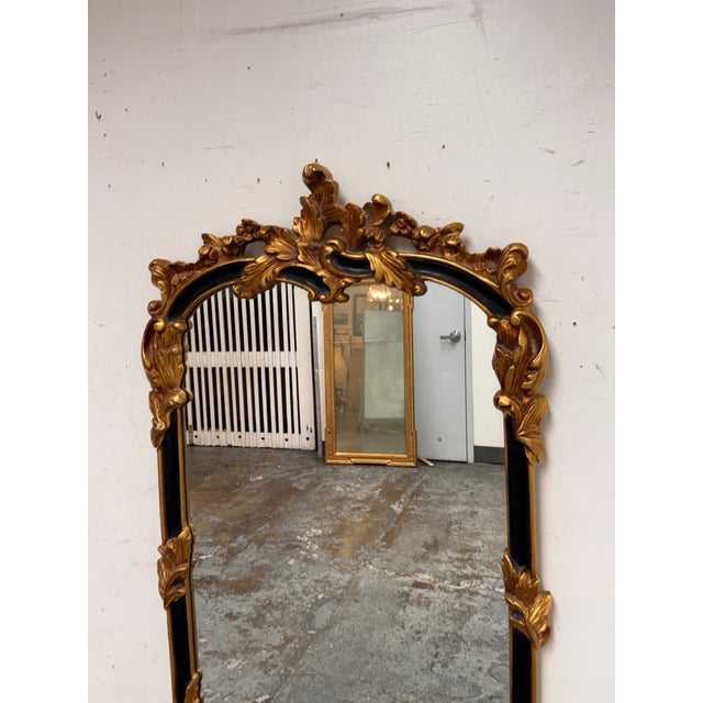 Design Plus Gallery presents a Rococo Revival Mirror from The Uttermost Company. This ornate wall mirror has an arched...
