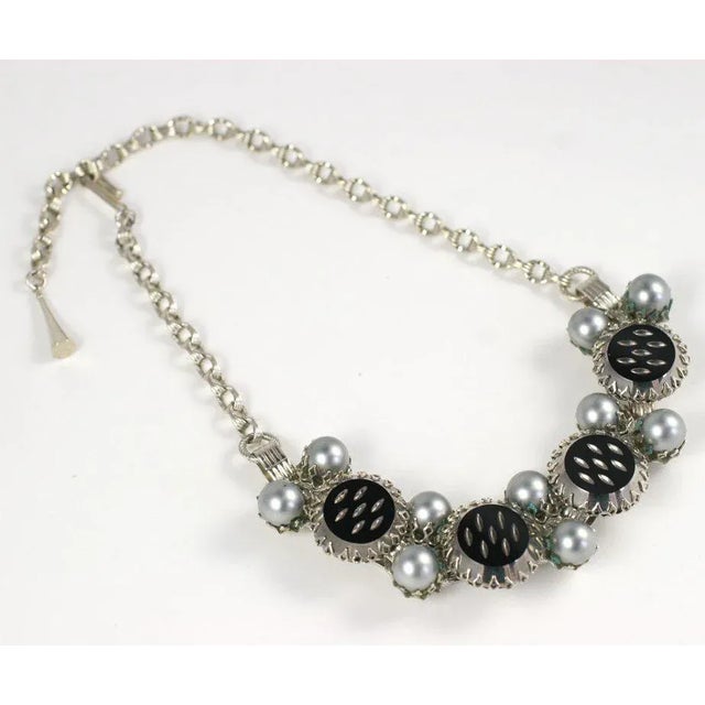 This is part of Chairish’s Costume Jewelry assortment. Strongly graphic prong set grey "pearls" and black and silver...
