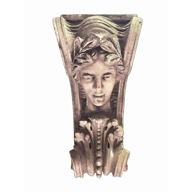 Antique early 20th century terra cotta facade keystone depicting Athena with beaded acanthus leaf and scroll design. Circa...