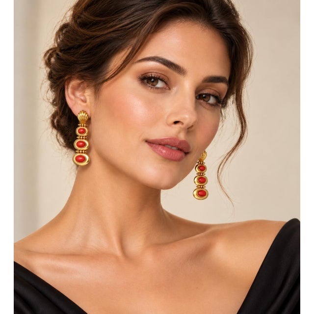 An enchanting tribute to maritime beauty and Mediterranean warmth, these striking three-station drop earrings are...