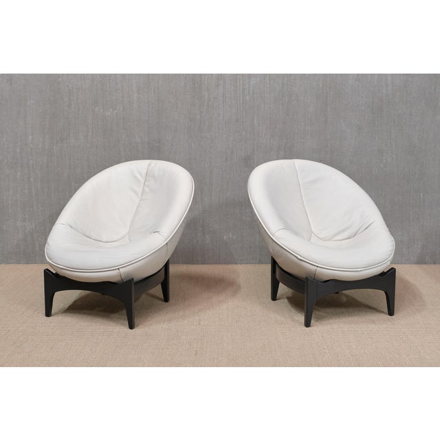 This exceptionally rare pair of armchairs was designed by Emiel Veranneman in 1992 and produced by De Sede in Switzerland....