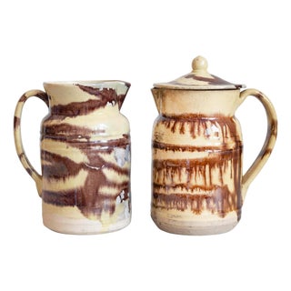 19th Century French Pottery Pitcher with Cream and Brown Glaze with Dripping For Sale