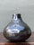 This vintage black ceramic vase exemplifies the refined simplicity and sculptural appeal of mid-century studio pottery....