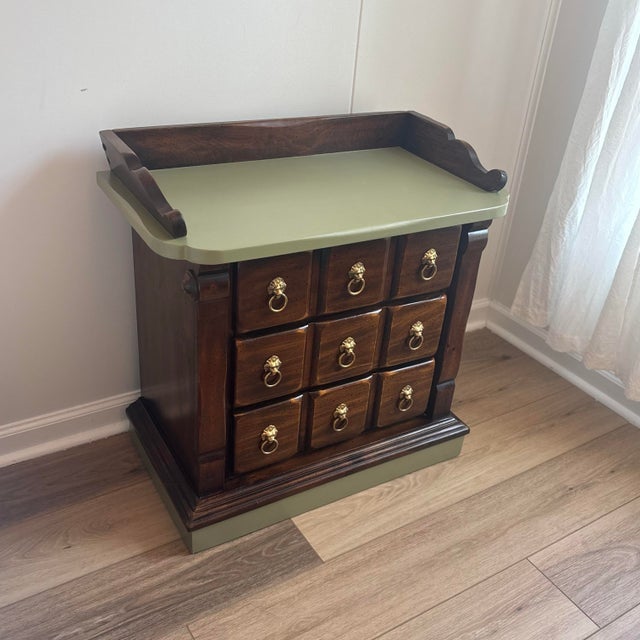 Solid pine wood 3-drawer mid century nightstand in excellent condition. Dark walnut patina with hand-painted olive sage...