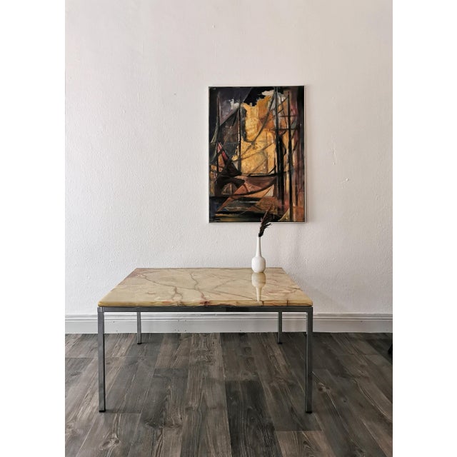 This coffee table dates from the 1960s and perfectly reflects the transition from mid-century to the Space Age era. It...