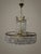 A real vintage highlight from the 1960s, this exquisite crystal glass and brass chandelier creates a warm, inviting...