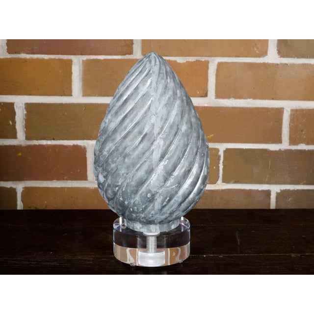 This charming French zinc pine cone shaped decorative object, hailing from circa 1920, merges the allure of nature with...