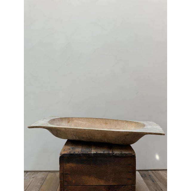 Exceptionally large wooden dough bowl originating from Hungary. Bowl has been hand-carved from one solid piece of wood....