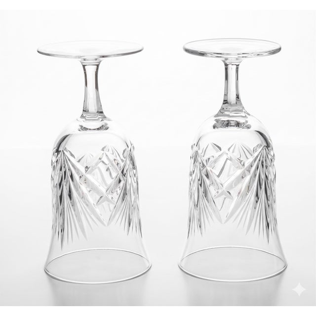 This stunning pair of footed iced tea glasses features Gorham's iconic 'Cherrywood' pattern and is a great example of...